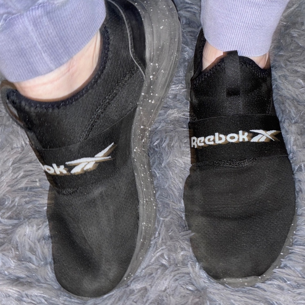 Well worn workout Reebok women’s black shoes